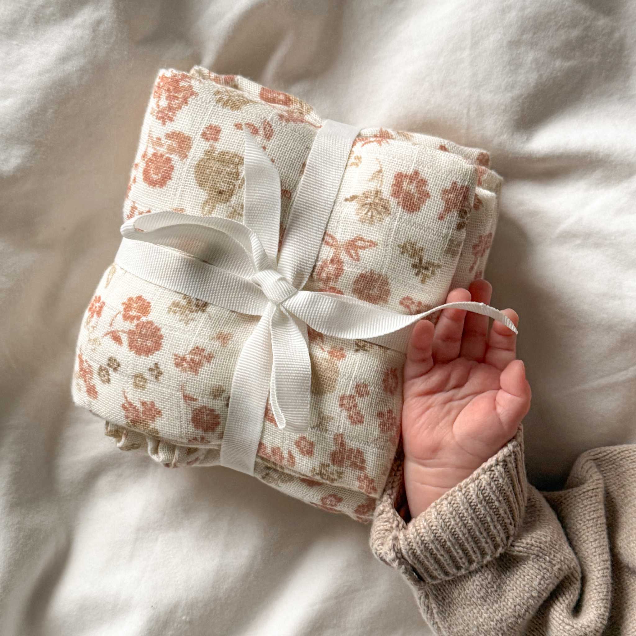 Baby's Hand With Cam Cam Augusta Muslin Cloths