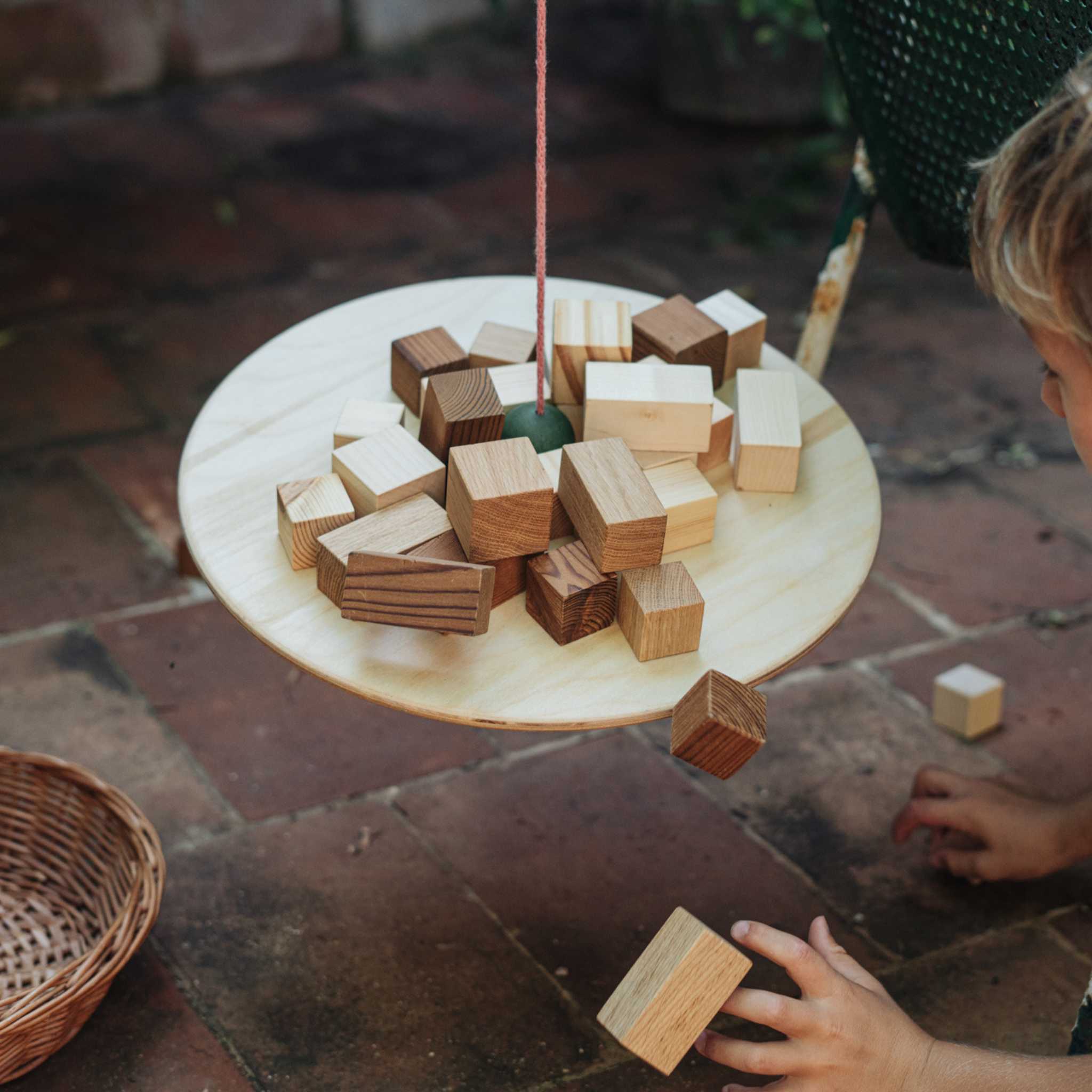 Boy Playing With Grapat Pendulum 